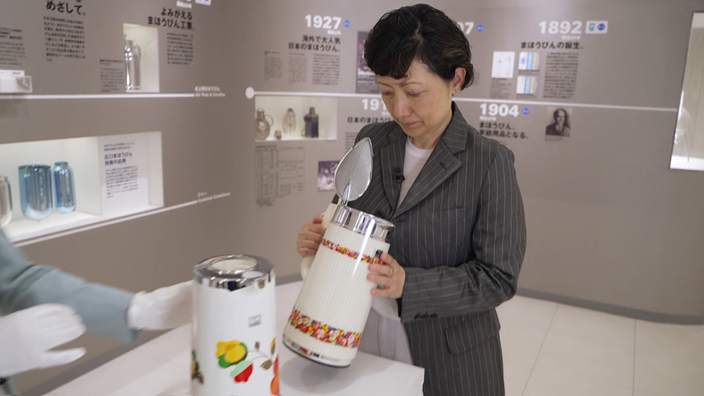 Igarashi looks inside the “magic bottle”.