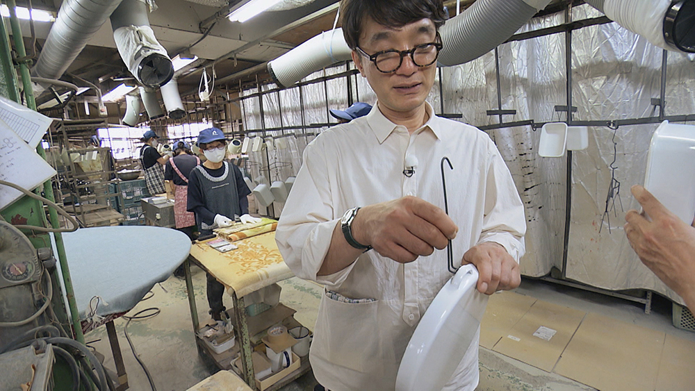 The handles are there for hanging during the manufacturing process.