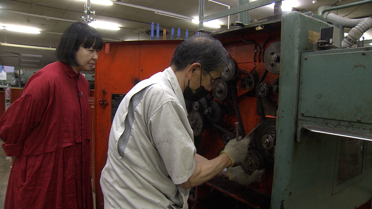 Craftsman adjusts a machine